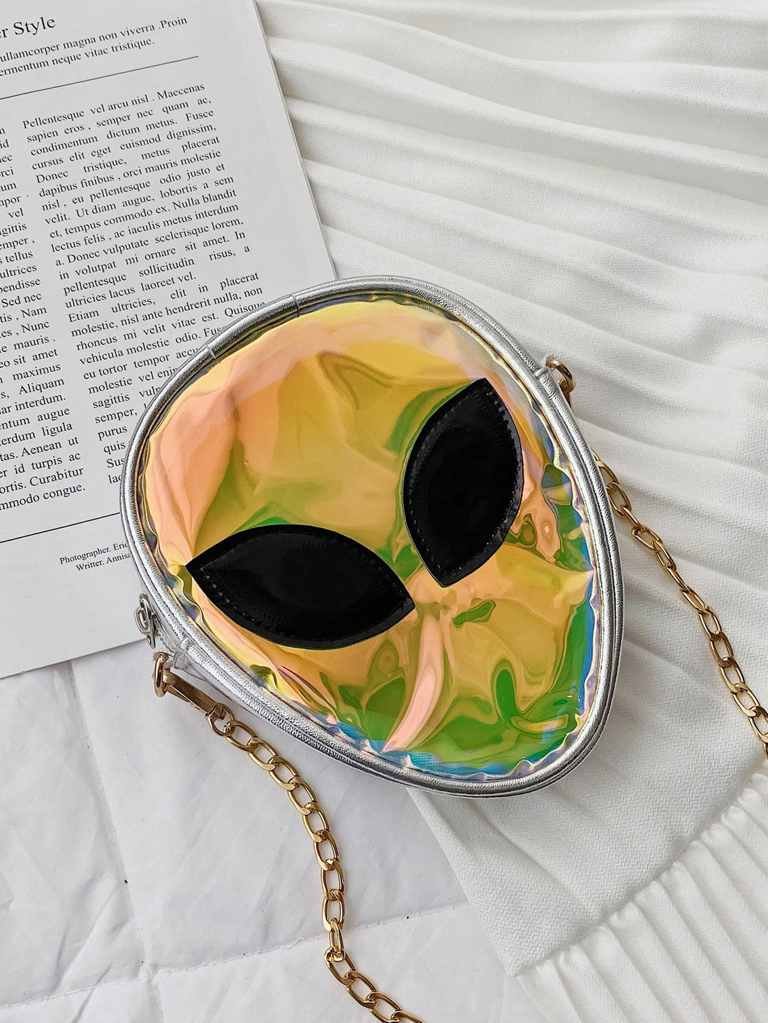 Enhance your music festival experience with our Color-Changing Holographic Alien Novelty Bag. This eye-catching bag features a holographic alien design that changes colors when exposed to light. The perfect funny gag gift for music festivals and a must-have accessory for any festival-goer.