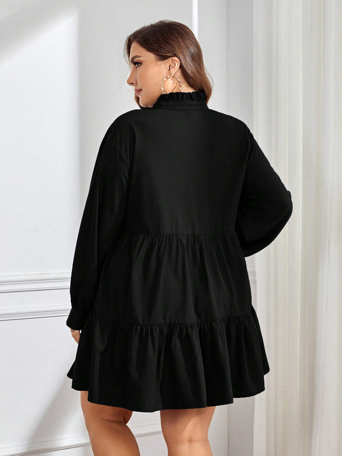 Step into graduation day with flair in this chic plus size smock dress featuring a playful notched neckline and flirty ruffle hem. Its relaxed fit keeps you comfy while celebrating in style, making it the perfect pick for making memories and turning heads at your special event.