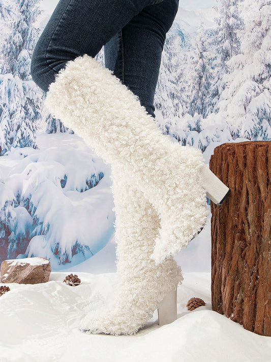 Stay cozy and stylish this winter with our Winter Wonderland Knee-high <a href="https://canaryhouze.com/collections/women-boots?sort_by=created-descending" target="_blank" rel="noopener">Boots</a>. These boots feature a warm and soft lining, perfect for cold weather. The back zipper makes them easy to slip on and off, while the knee-high design provides extra coverage. Bring a touch of elegance to your winter wardrobe with these white boots.