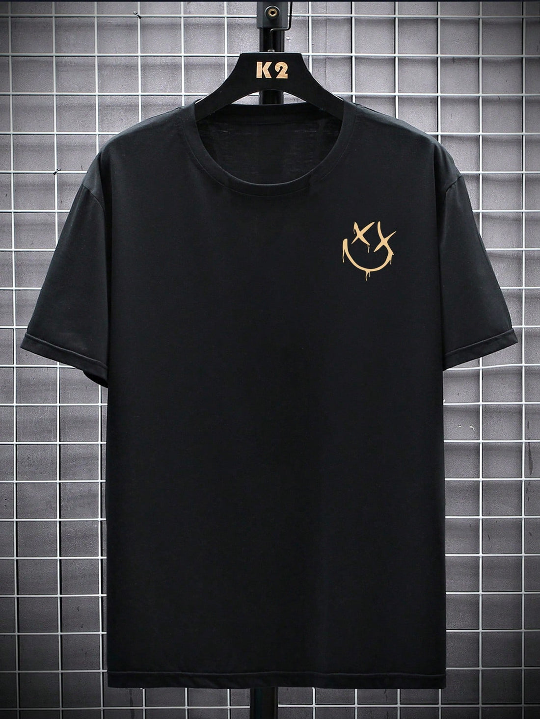 This t-shirt features a statement expression print and a modern drop shoulder design, perfect for men looking to elevate their style. Made with high-quality materials, it offers both comfort and fashion. Make a statement with this unique piece.