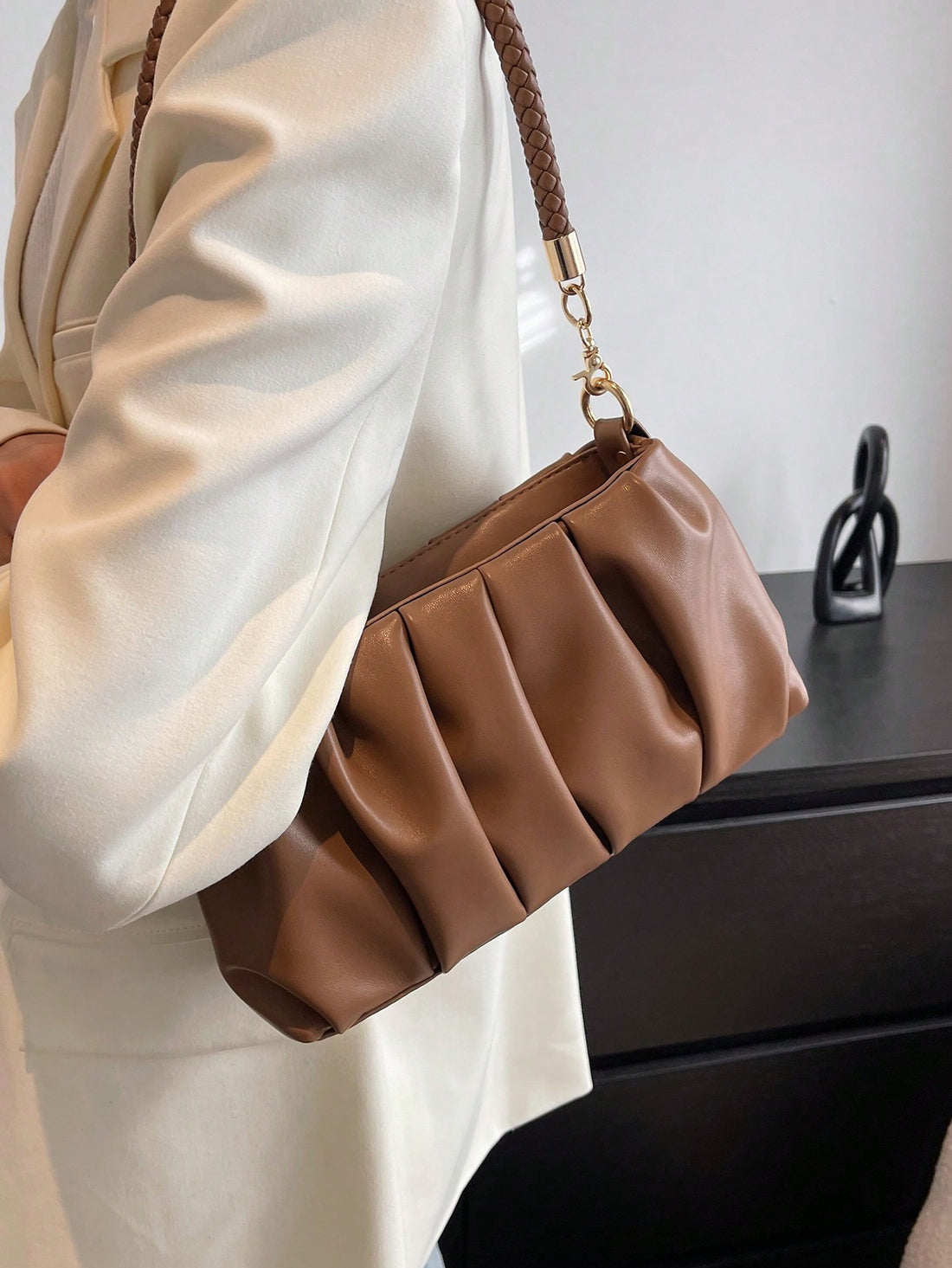 This Pleated Perfection Vintage Retro Single Shoulder Bag boasts a chic design and functional features. Perfect for carrying your essentials, it offers hands-free convenience and style. With its pleated details and single shoulder strap, it adds a touch of vintage charm to any outfit.