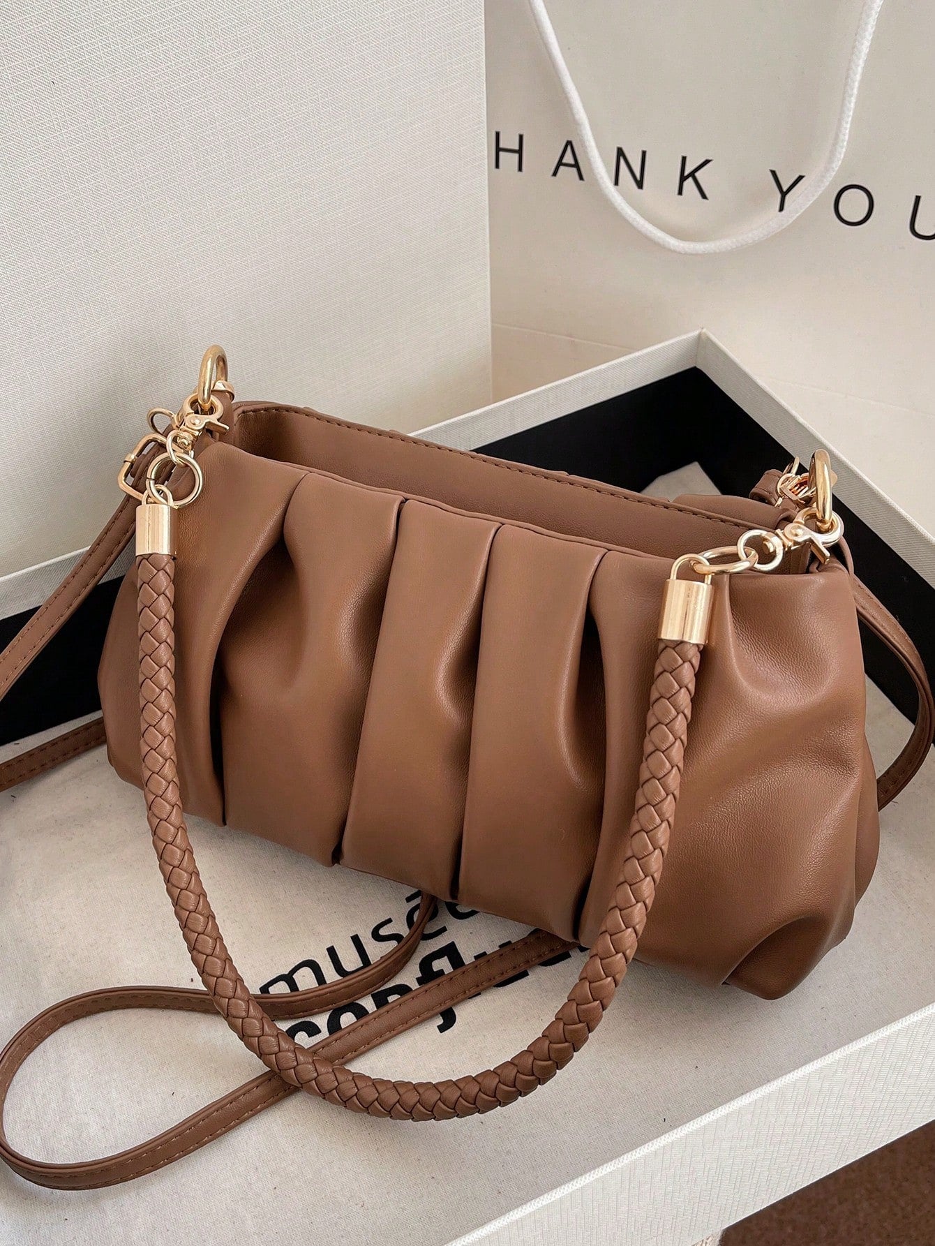 This Pleated Perfection Vintage Retro Single Shoulder Bag boasts a chic design and functional features. Perfect for carrying your essentials, it offers hands-free convenience and style. With its pleated details and single shoulder strap, it adds a touch of vintage charm to any outfit.