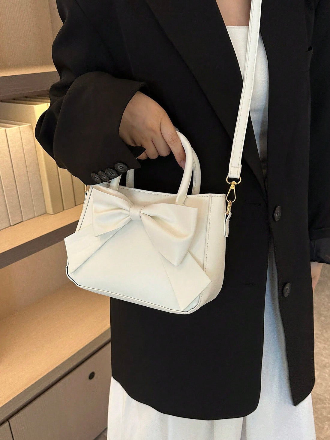 Introducing the must-have accessory for fashionable women - the Chic and Stylish Bow-Decor Handbag! With its elegant design and eye-catching bow decor, this handbag will elevate any outfit and make a statement. Stay stylish and on-trend with this must-have piece.