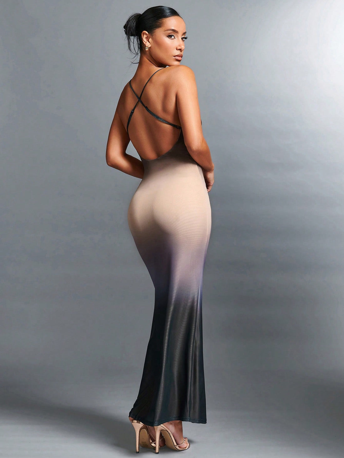 This stunning Christmas party dress will make you the center of attention. With its open back design, you'll feel glamorous and confident. The radiant fabric will catch the light and add a touch of elegance to your holiday look. Perfect for any festive occasion.