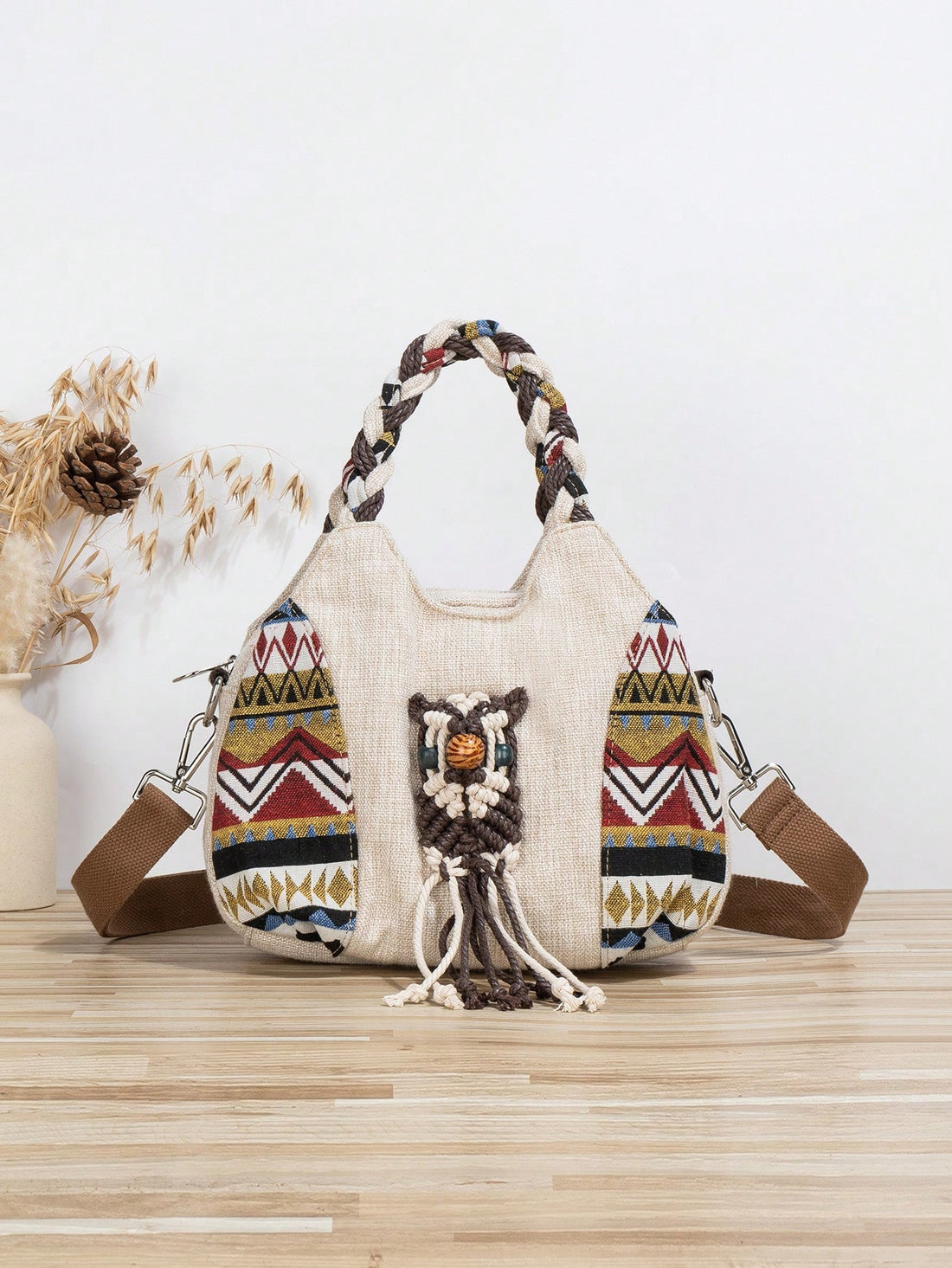 Elevate your fashion game with our Bohemian Owl: Handmade Woven Crossbody Shoulder Handbag. Expertly crafted with intricate woven details, this bag exudes a bohemian charm that will make a statement. With a spacious design and comfortable shoulder strap, it offers both style and functionality. Perfect for any unique and trendy outfit.