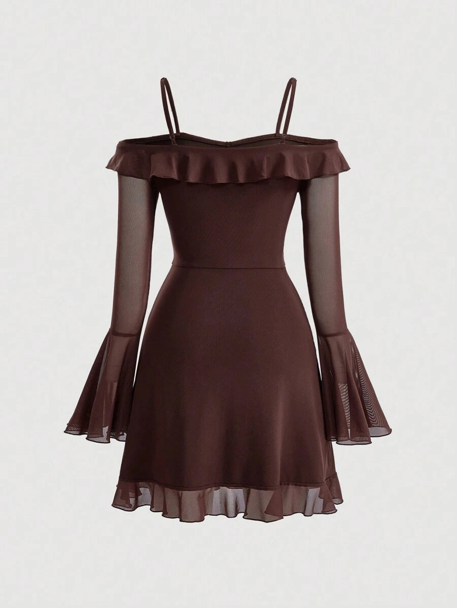 This sophisticated mini dress combines contemporary design elements with timeless elegance. The cold shoulder neckline creates a modern silhouette, while delicate ruffle trim adorns the flare sleeves for added dimension and movement. Crafted from soft, flowing chiffon, the fabric drapes beautifully and offers comfortable wear throughout the day. The asymmetrical hemline adds an artistic touch, elevating the dress beyond conventional styles. Perfect for cocktail events, date nights, or elevated casual occasi