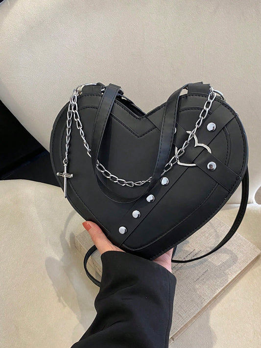 This punk rock festival must-have is a Rivet Embllelished Heart Shaped Cross Body Bag. Made with durable materials and adorned with rivet embellishments, it's perfect for carrying all your essentials while rocking out at concerts. Stay stylish and hands-free with this edgy cross body bag.