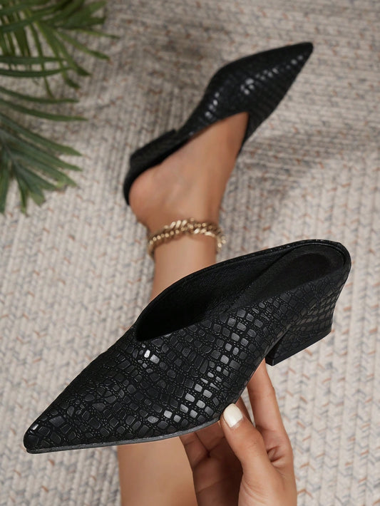 Elevate your style with our Chic and Stylish Pointed Toe Irregular <a href="https://canaryhouze.com/collections/women-canvas-shoes" target="_blank" rel="noopener">Heel Mules</a>. These Black High Heels are perfect for the Autumn and Winter season. The pointed toe adds sophistication, while the irregular heel adds a unique touch. Achieve a trendy and polished look with our must-have mules.