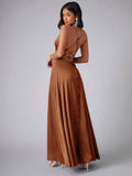 Back view of brown satin dress showing open crisscross lace-up straps