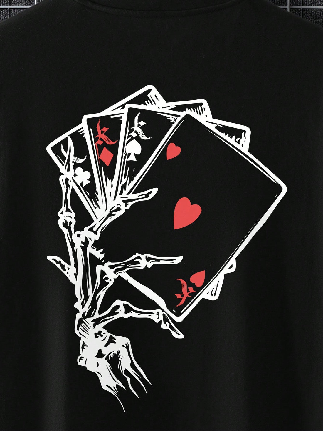 This Men's Poker Card and Skull Hand Print T-shirt in the Ace of Spades Edition is a must-have for any poker or skull enthusiasts. The unique design features a bold print that is perfect for making a statement. Made from high-quality materials, this t-shirt offers both style and comfort.