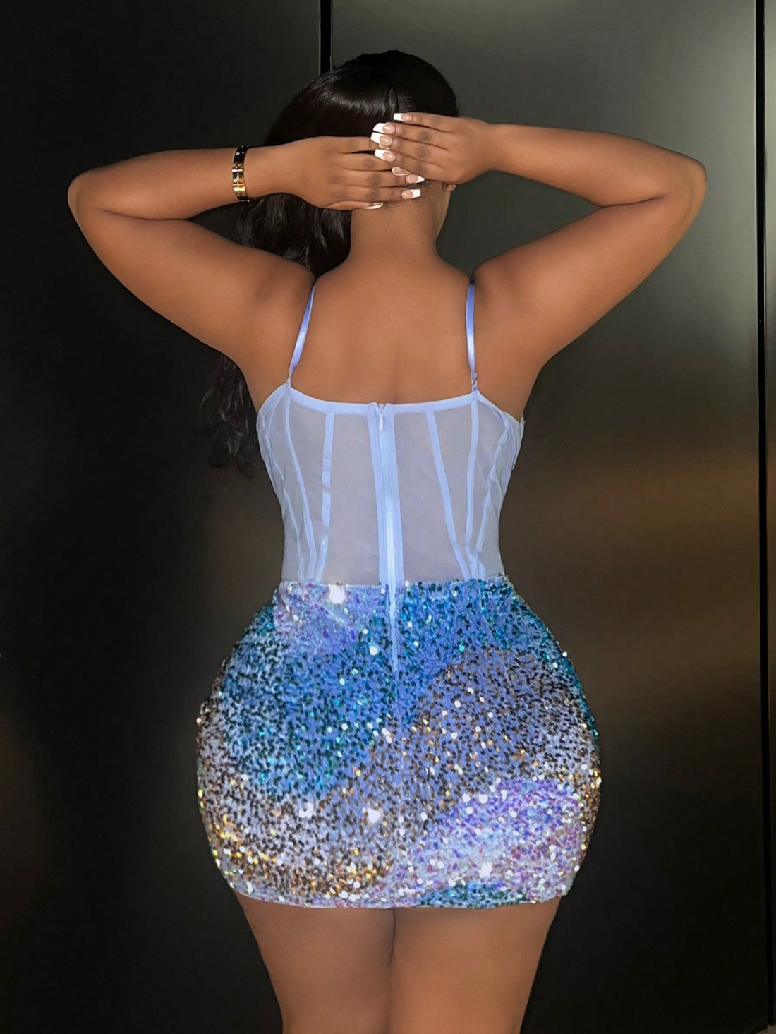 Add glamour and confidence to your night out with our Sparkling Elegance: Plus Size Sequin Strap Dress. Made with high-quality sequin material, this dress shines and sparkles with every movement. The plus size and adjustable straps ensure a comfortable and stunning fit all night long.