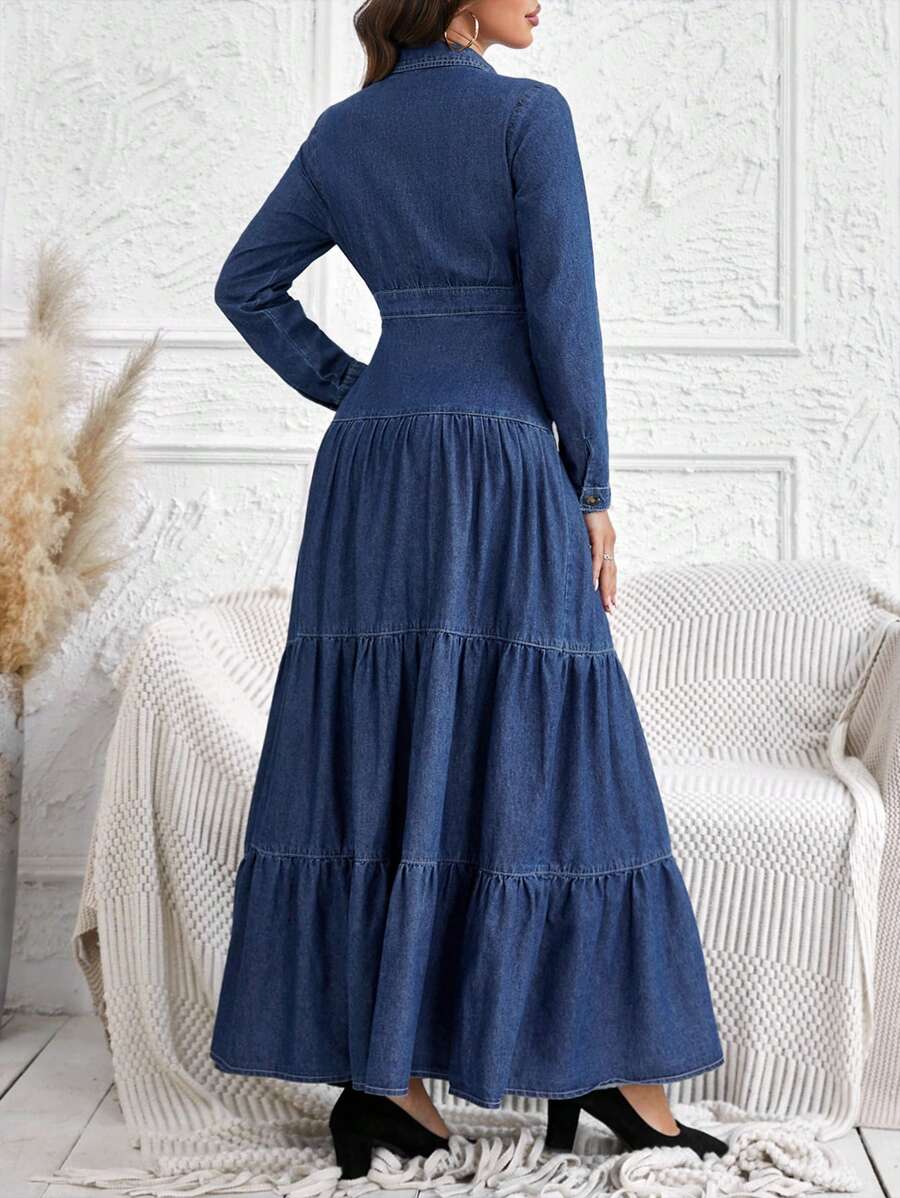 Back view of denim shirt dress showing long sleeves and full tiered skirt