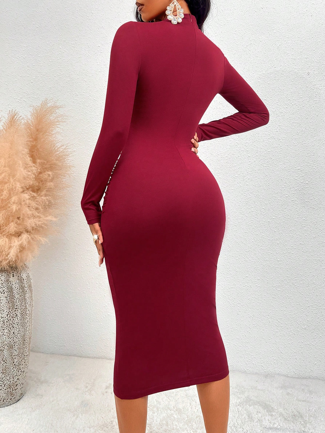 Elevate your style with our chic mock neck cut-out ruched bodycon dress. Made with a figure-flattering fit, this dress features a stylish mock neck and cut-out design, along with ruched detailing for added texture. Perfect for any occasion, this dress will easily become a staple in your wardrobe.