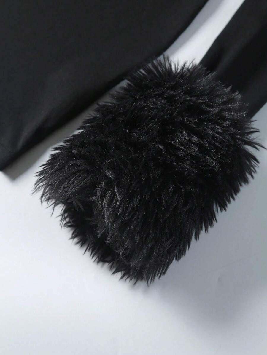 Close-up black shaggy faux fur cuff on long sleeve dress