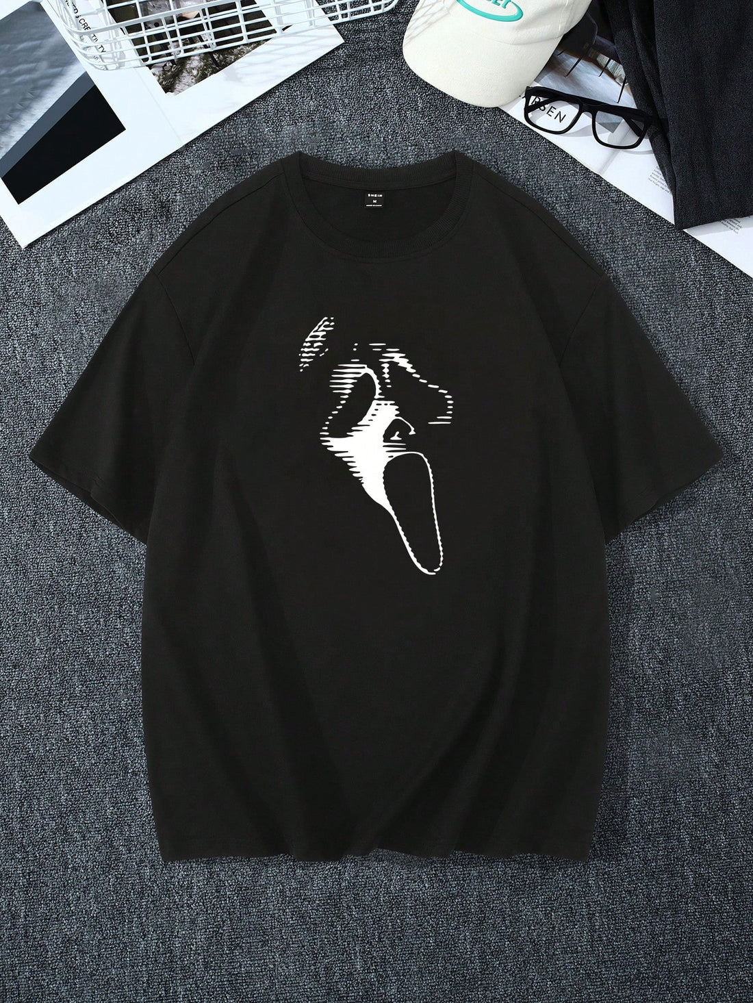 Unleash your inner ghost with our Ghost Face Men's Loose Fitting Tee! With its loose-fitting style, you'll stay comfortable while still looking hauntingly cool. Perfect for any casual occasion, this tee is the epitome of spooky fashion. Embrace the ghostly vibes and stand out in style.