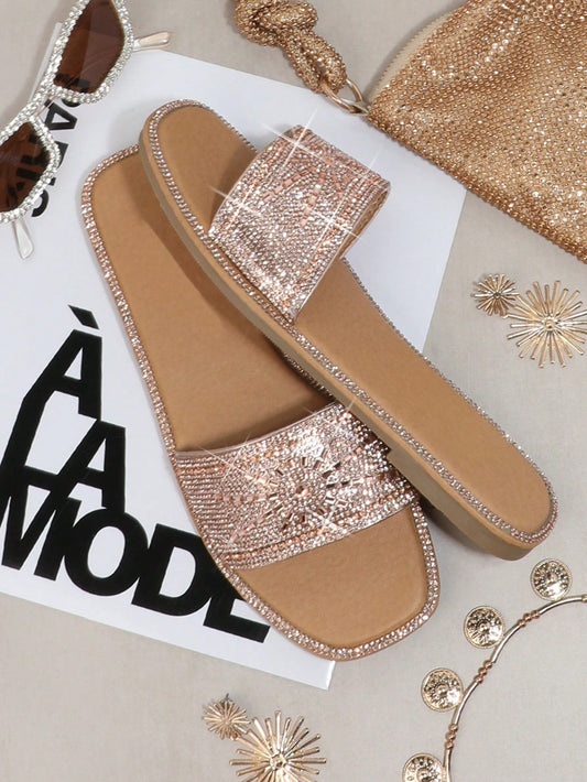 Elevate your style with our Dazzling Rhinestone Flat <a href="https://canaryhouze.com/collections/women-canvas-shoes?sort_by=created-descending" target="_blank" rel="noopener">Sandals</a> for Women! Made with shimmering rhinestones, these sandals will add a touch of glam to any outfit. Step out in confidence and comfort with our fashionable and eye-catching sandals. Perfect for any occasion, these sandals are a must-have for every fashion-forward woman.