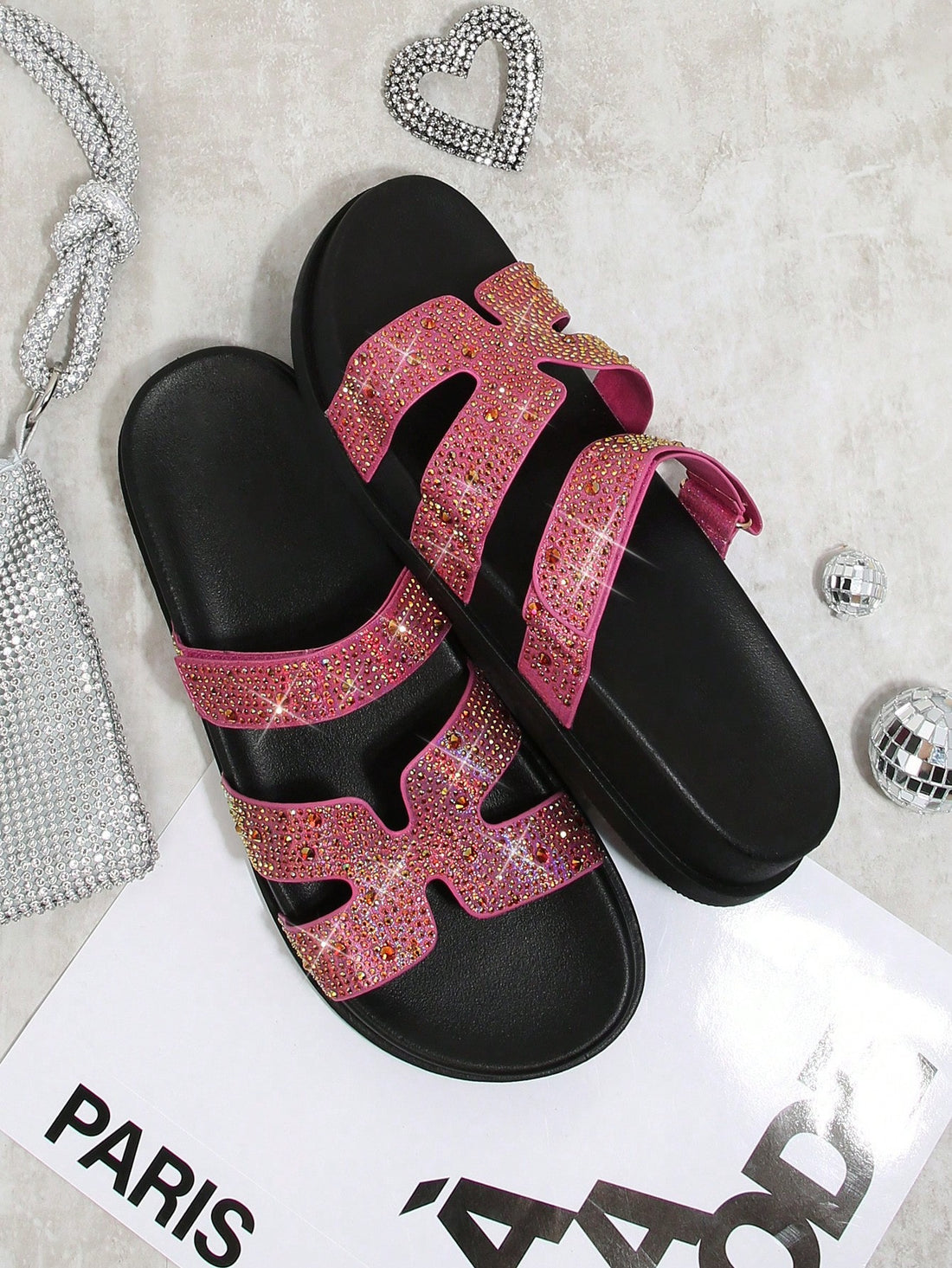 Elevate your style with Sparkling Steps: Rhinestone Decorated Flat Sandals for Women. Embellished with sparkling rhinestones, these sandals add the perfect touch of glamour to any outfit. Comfortable and stylish, these sandals are a must-have for any fashion-forward woman. Perfect for any occasion, from casual outings to special events.