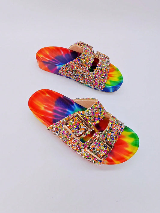 These Street Chic Graffiti Double-Buckle Slippers provide stylish comfort for your leisure and vacation needs. With their unique graffiti design, double-buckle fastening, and comfortable fit, they are perfect for strolling around town or lounging by the pool. Get ready to step up your style game with these trendy slippers.