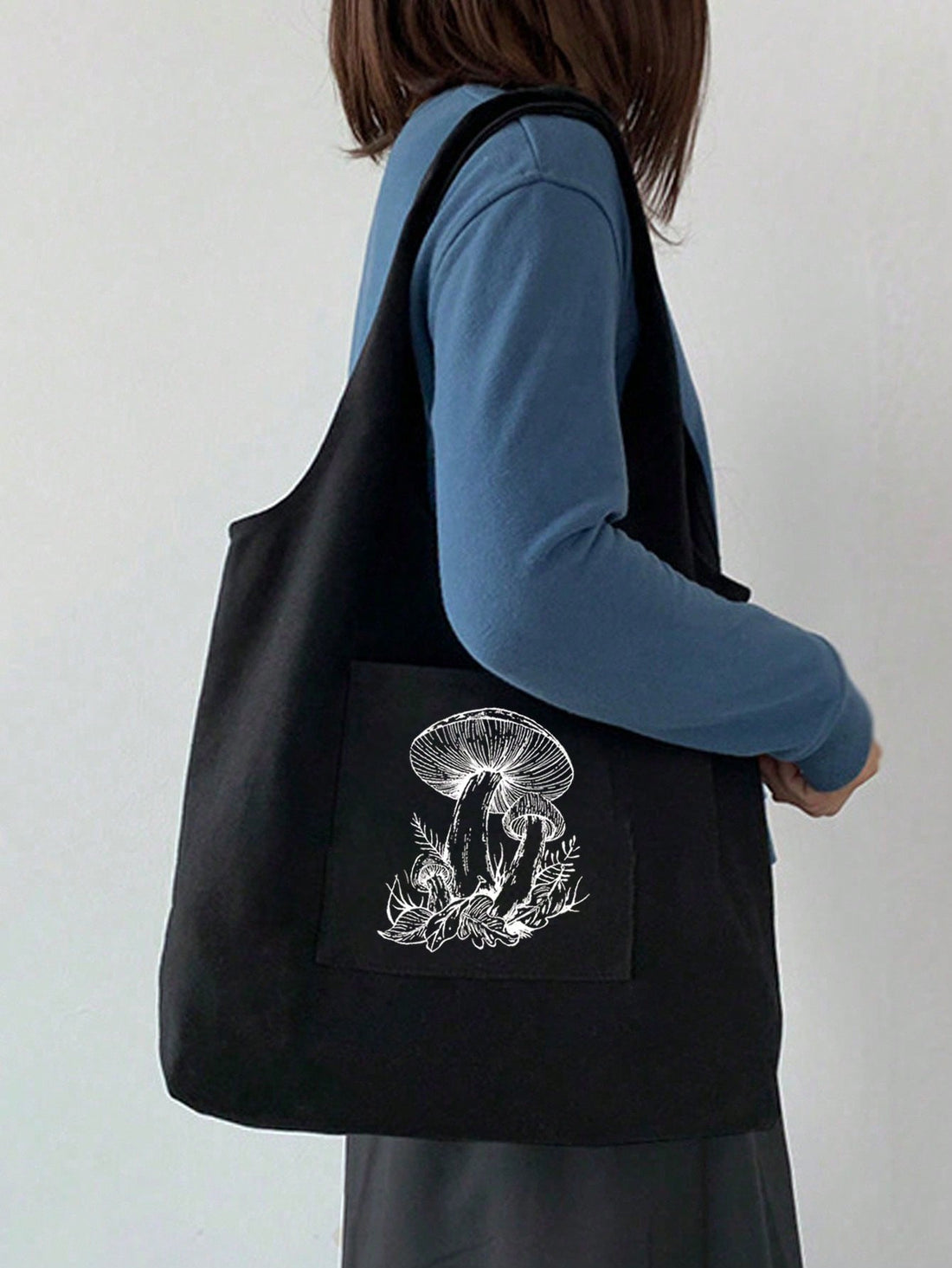 Introducing Mushroom Madness: The perfect blend of fashion and minimalism. Crafted from high-quality canvas, this tote bag is not only stylish but also durable. With its spacious interior and sturdy handles, it's the ideal accessory for any occasion. A must-have for mushroom lovers and anyone looking for a unique gift.