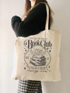 This House of Wind Book Club Tote Bag is both stylish and practical, making it the perfect gift for book lovers this holiday season. With its spacious design, it's the perfect companion for carrying books, electronics, and more. Bring convenience and style to your next book club meeting with this must-have tote.