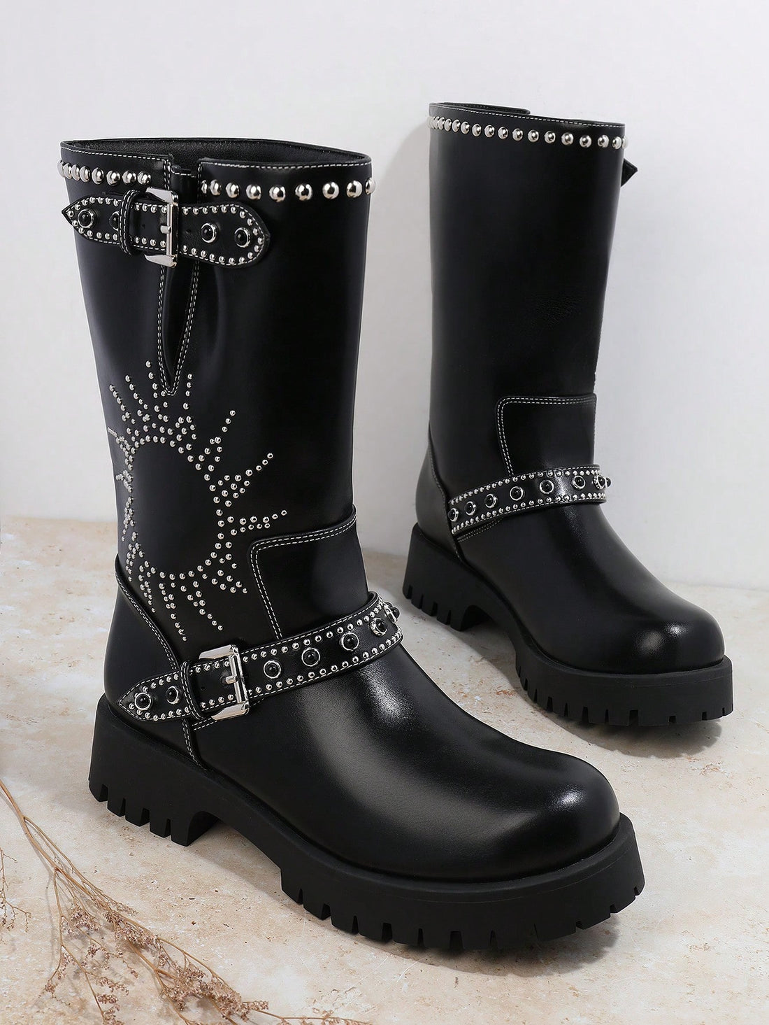 Step into bold fashion with Studded Chic: Women's Belted Cowboy Boots. These boots feature studded details and a belted design, perfect for making a statement. Made from durable materials, these cowboy boots offer both style and functionality for any occasion. Elevate your look with these chic boots.