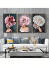 Introduce sophistication to your living room with this Modern Floral Lady Poster set. Featuring a contemporary design of pink and white flowers, these canvas art pieces will elevate your wall decor. Perfect for adding a touch of color and style to any space.