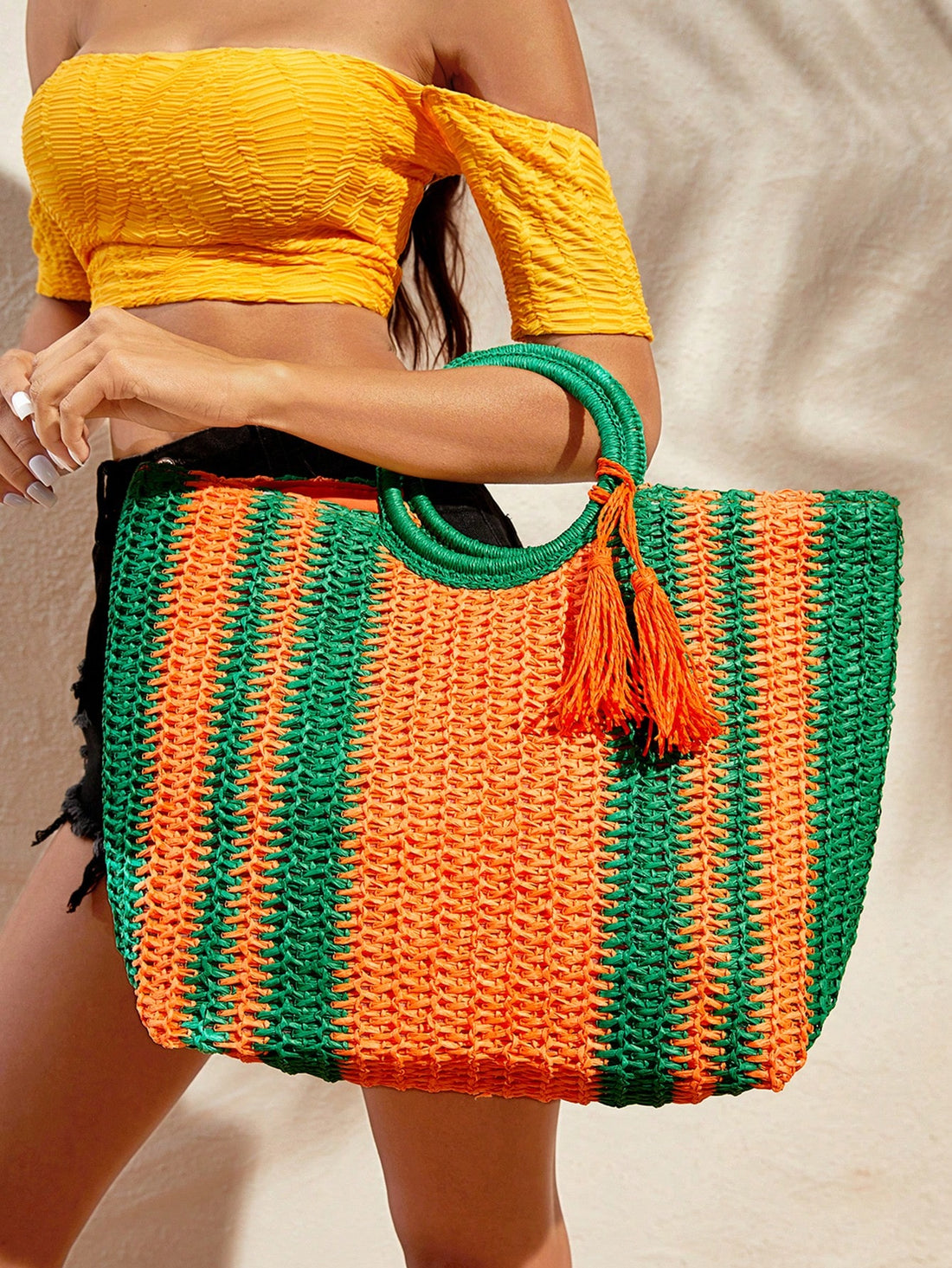 Experience effortless style and convenience with our Sunset Vibes Tote Bag. Expertly crafted with tassel accents and lightweight straw material, this spacious bag is perfect for your summer adventures. Stay organized and chic while soaking up the sun