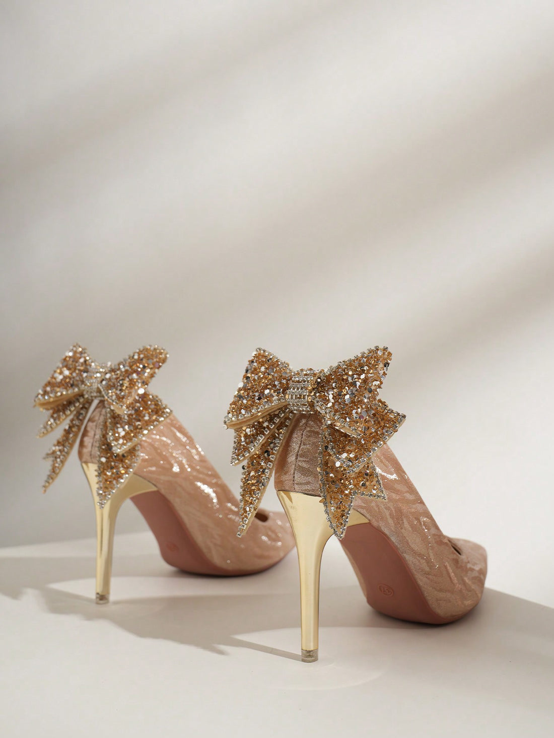 Add some sparkle to any special occasion with these Elegant Champagne Sequin Stiletto Pumps! The beautiful bowknot detail adds a touch of elegance, making them perfect for weddings and other special events. These pumps will have you feeling chic and glamorous.