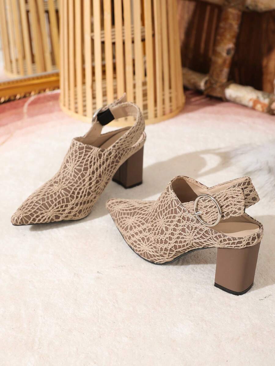 Rear three-quarter product view of taupe slingback pumps with round silver-tone buckles and brown heels