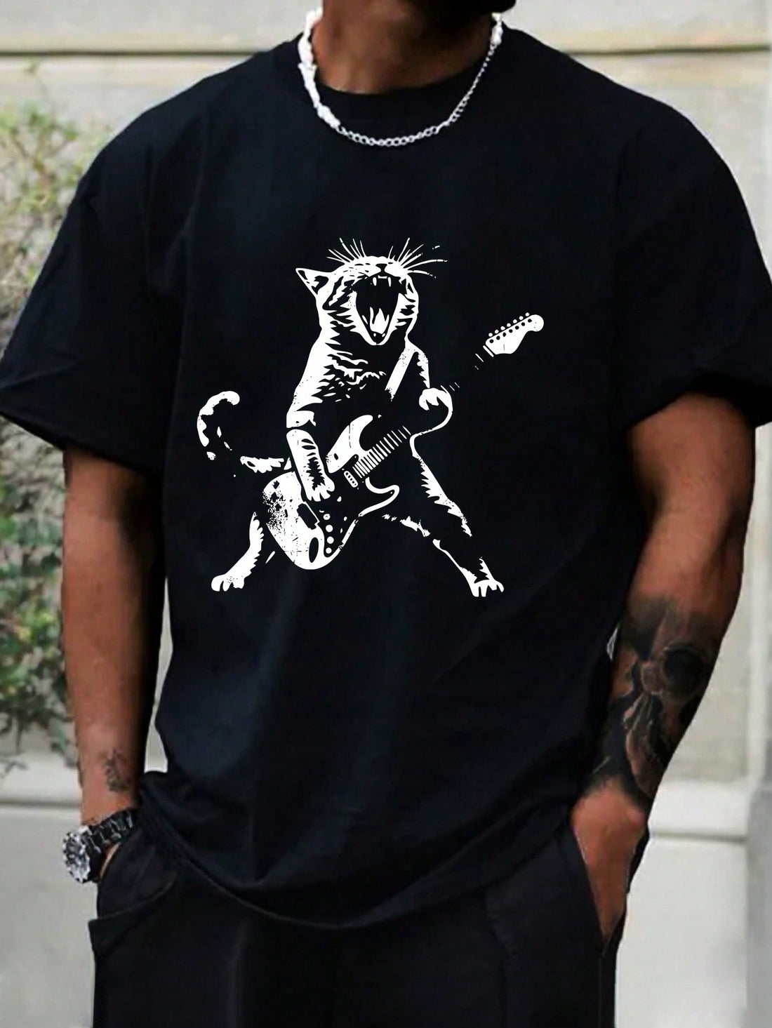 As a product expert, I introduce you to Rockin' Feline: Men's Cat Playing Guitar Printed T-Shirt. This shirt features a stylish design of a guitar-playing cat, perfect for cat lovers and music enthusiasts. Made with premium-quality fabric, this shirt offers comfort and durability. Upgrade your wardrobe with this unique and eye-catching addition.