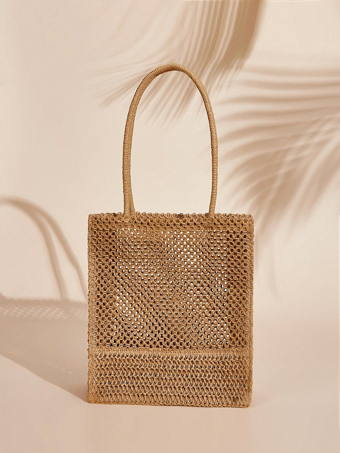 This Summer Style Essential is a must-have for any woman. Made from durable straw, it is the perfect accessory for the warmer months. Its solid design adds a touch of sophistication while its size is spacious enough to store all your essentials. Stay stylish and organized with this straw bag.