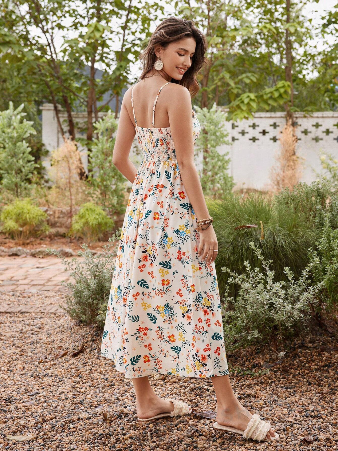 This Floral Fantasy Cami Dress for women is perfect for the summer season. The lightweight fabric and flowy design make it both comfortable and stylish. With its eye-catching floral pattern, it's a must-have for any fashion-forward woman. Stay cool while looking chic in this must-have summer dress.