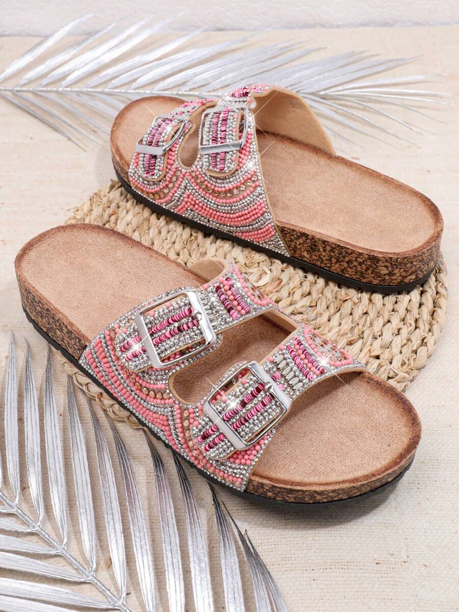Pink embellished slide sandals with beads sequins and cork-look footbed