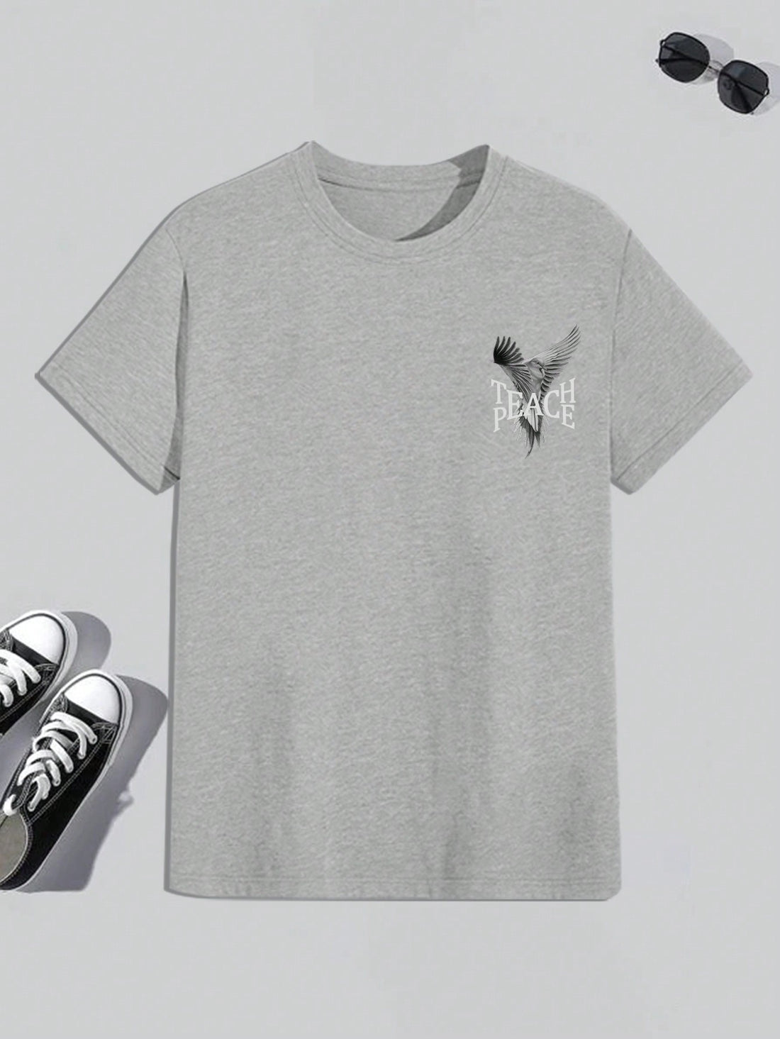 Elevate your style with our Men's Pigeon Letter Print Round Neck T-Shirt. Featuring a unique pigeon letter print, this shirt will make you stand out from the crowd. Made with quality materials, it offers both comfort and durability. Fly high in style and make a statement with this T-Shirt.
