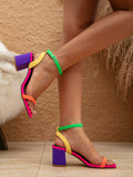 Side view multicolor block heel sandals with green ankle straps yellow back straps orange toe straps and hot pink footbeds