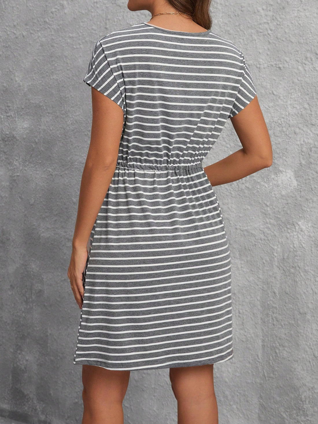 Add a touch of chic to your spring wardrobe with this cinched waist casual dress featuring playful stripes and convenient pockets. Flatter your figure and stay stylishly comfortable all day. Perfect for any occasion. Who says you can't have it all?