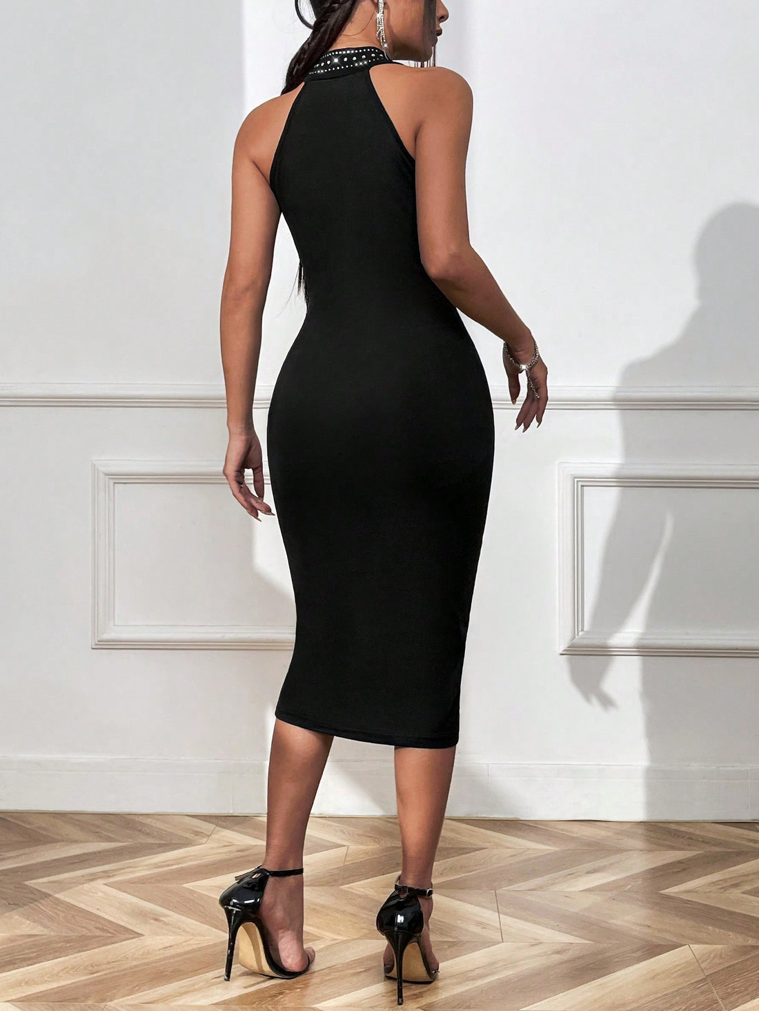 Introducing Sparkling Allure's Hollow-Out Halterneck Bodycon Dress, designed to flatter the female silhouette. Made with soft, high-quality fabric and intricate hollow-out details, this dress is perfect for any occasion. Show off your curves in style and feel confident in the alluring design of this dress.