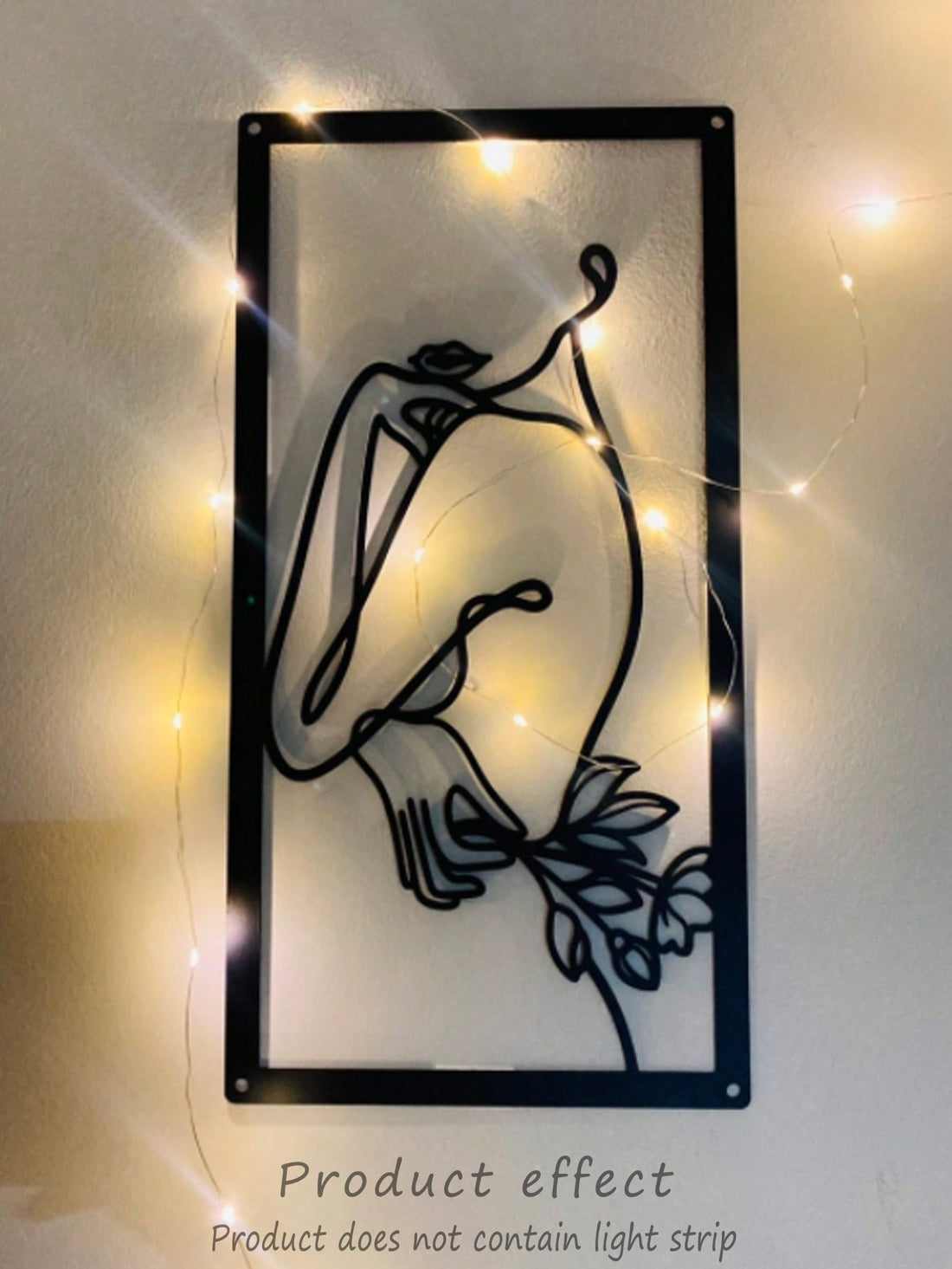 Add a touch of elegance to your home decor with our Woman Holding a Flower Wall Painting. Made of high-quality iron, this stylish piece features intricate details and adds a feminine touch to any room. Bring beauty and sophistication to your space with this unique artwork.