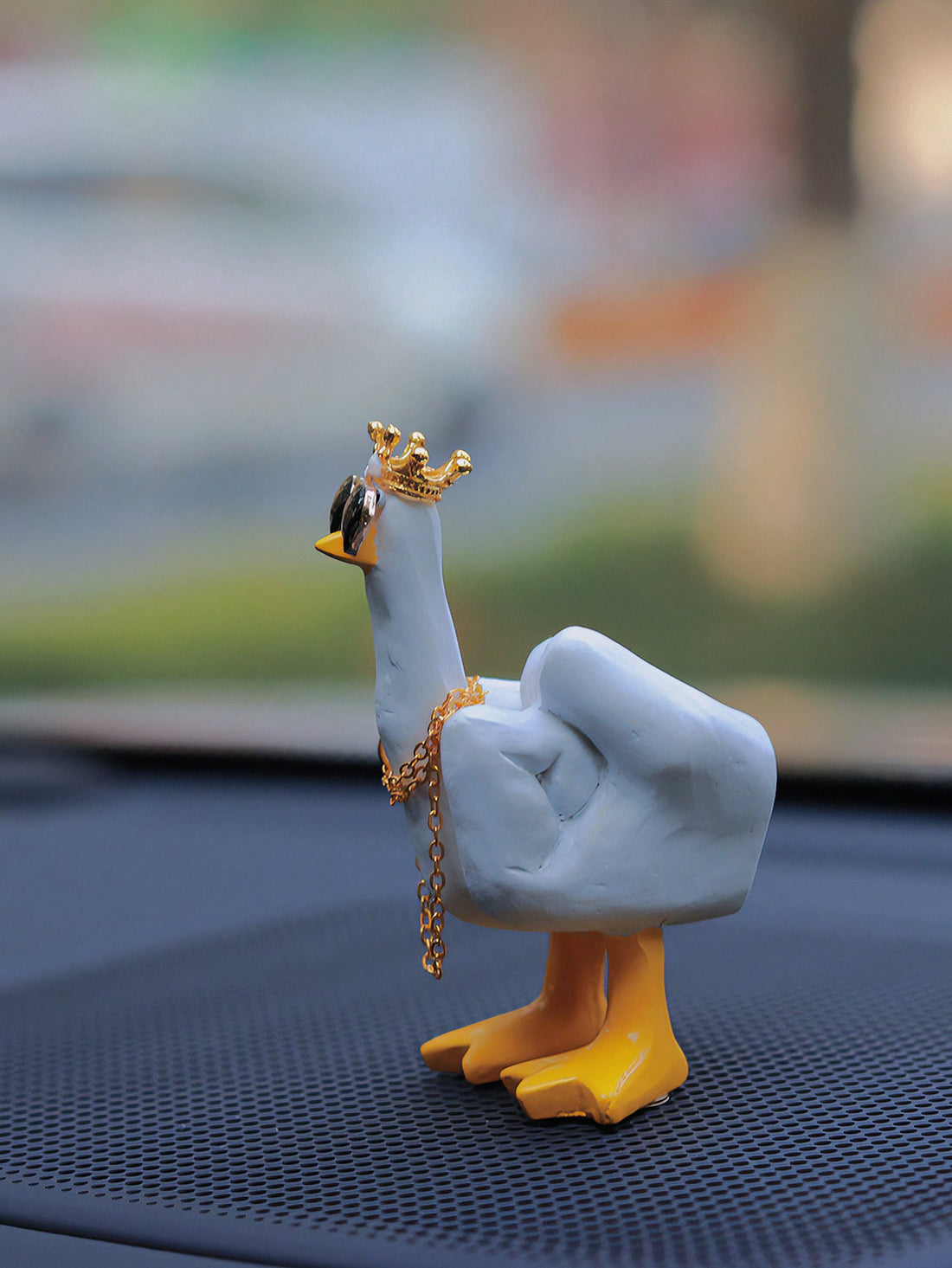 Add some humor and style to your car with the Impress with Attitude Middle Finger Duck Car Ornament. This sturdy and unique accessory features a duck flipping the middle finger, wearing sunglasses and a chain. Show off your attitude and make a statement while on the road.