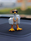 Add some humor and style to your car with the Impress with Attitude Middle Finger Duck Car Ornament. This sturdy and unique accessory features a duck flipping the middle finger, wearing sunglasses and a chain. Show off your attitude and make a statement while on the road.