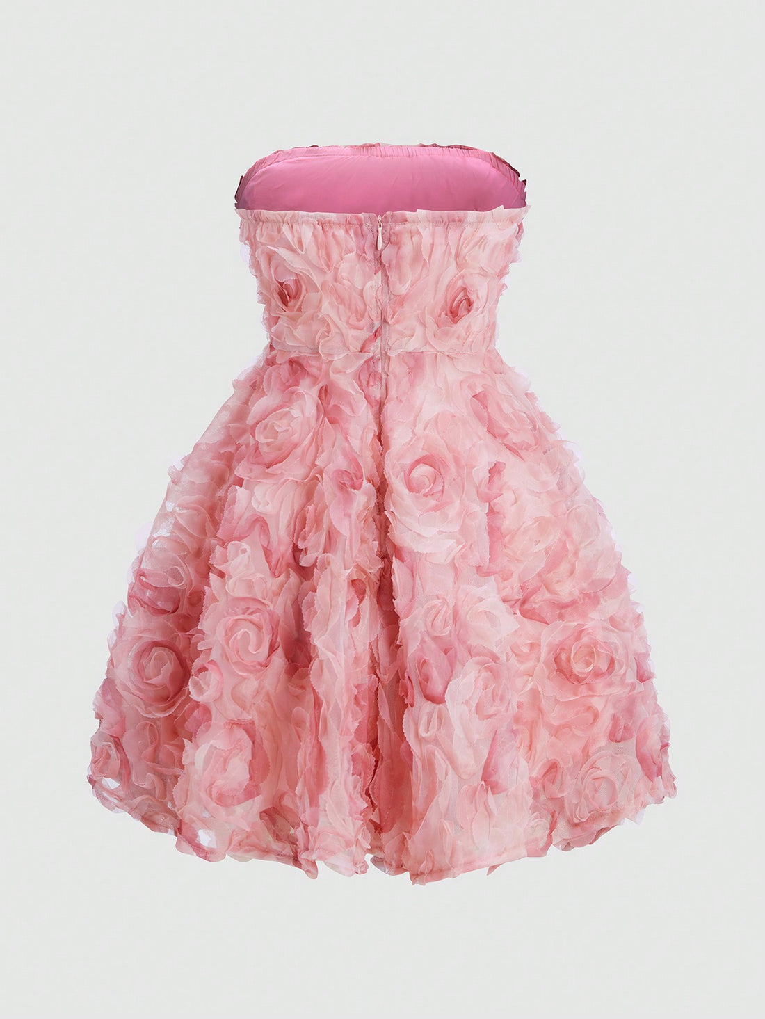 Turn heads in this playful strapless mini dress adorned with charming 3D flower appliqués. Perfect for stylish outings, its flattering cut and eye-catching details bring a fun, flirty vibe to your wardrobe. Embrace effortless elegance and let your confidence bloom wherever you go!