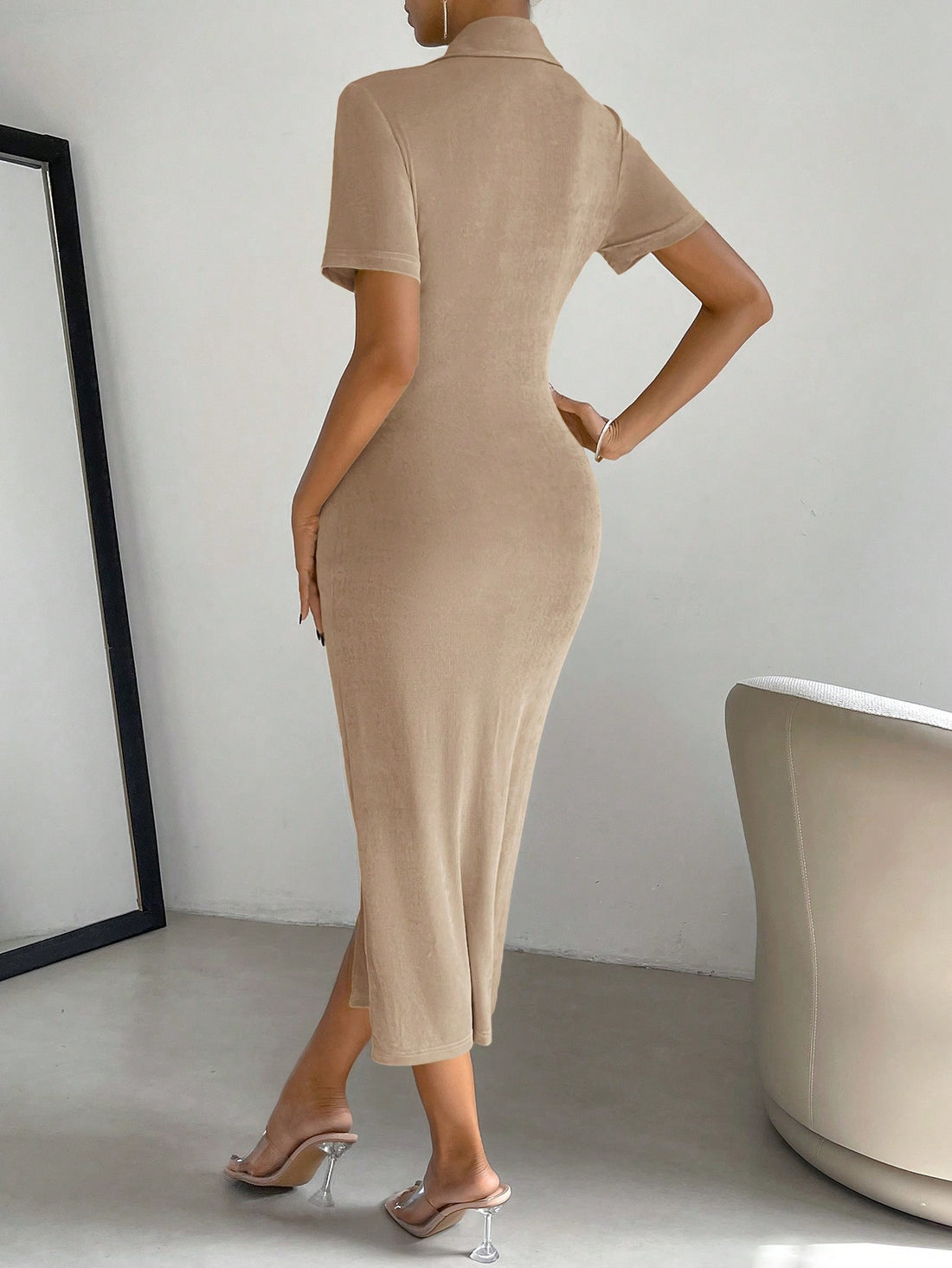 Effortlessly elevate your style with our Elegant Pleated Collar Wrap Dress. The high slit adds a touch of flare while the pleated collar adds a touch of sophistication. Perfect for any occasion, this dress will make you feel confident and stylish. (No need to put in the features as they are already included in the title.)