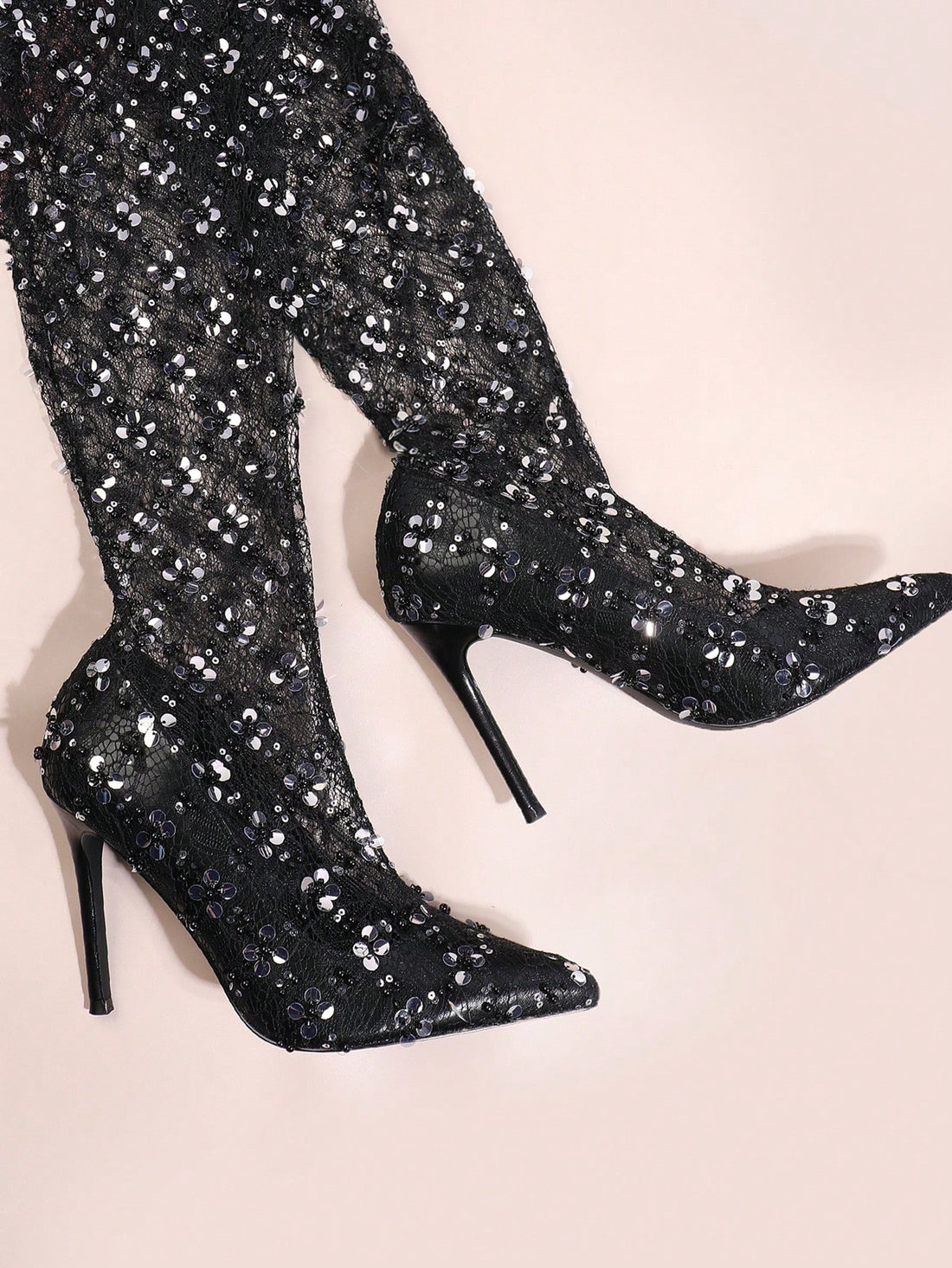 Upgrade your shoe game with Stylish Sparkle: The Must-Have Black Over-The-Knee Boots. Featuring a chic and timeless design, these boots are made from high-quality materials for both comfort and durability. Elevate any outfit with these must-have boots and stand out with style and confidence.