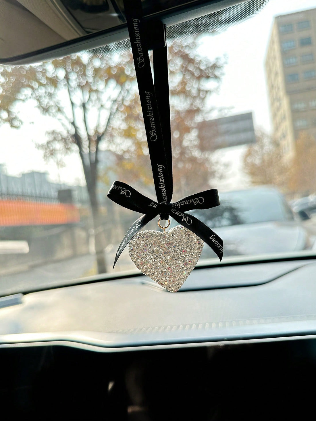 Add a touch of love to your car with our Love on the Road heart-shaped car pendant for women. Made from high-quality materials, this stylish and elegant pendant is the perfect accessory for any car. With its unique heart shape, it symbolizes love and adds a charming touch to your vehicle.