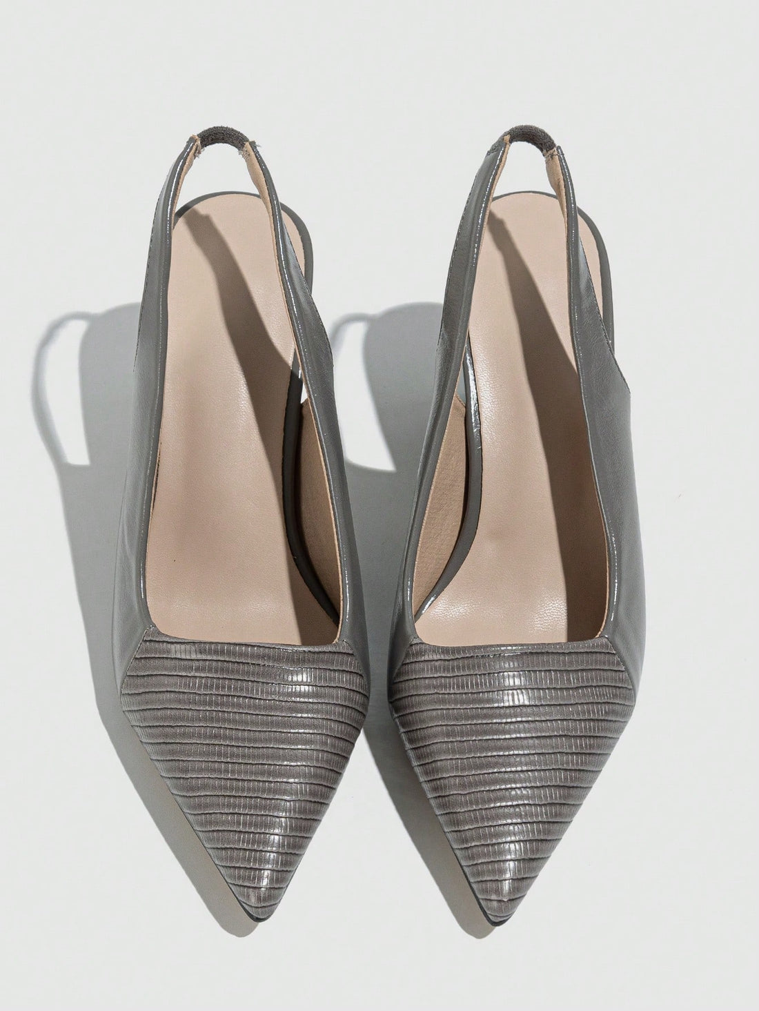 Add a touch of perfectly pointed elegance to your outfit with our Chic Embossed High Heel Pumps. These stylish pumps feature an ankle strap for added support and comfort. The embossed design adds a unique flair to your look. Perfect for any occasion where you want to show off your chic and playful style!