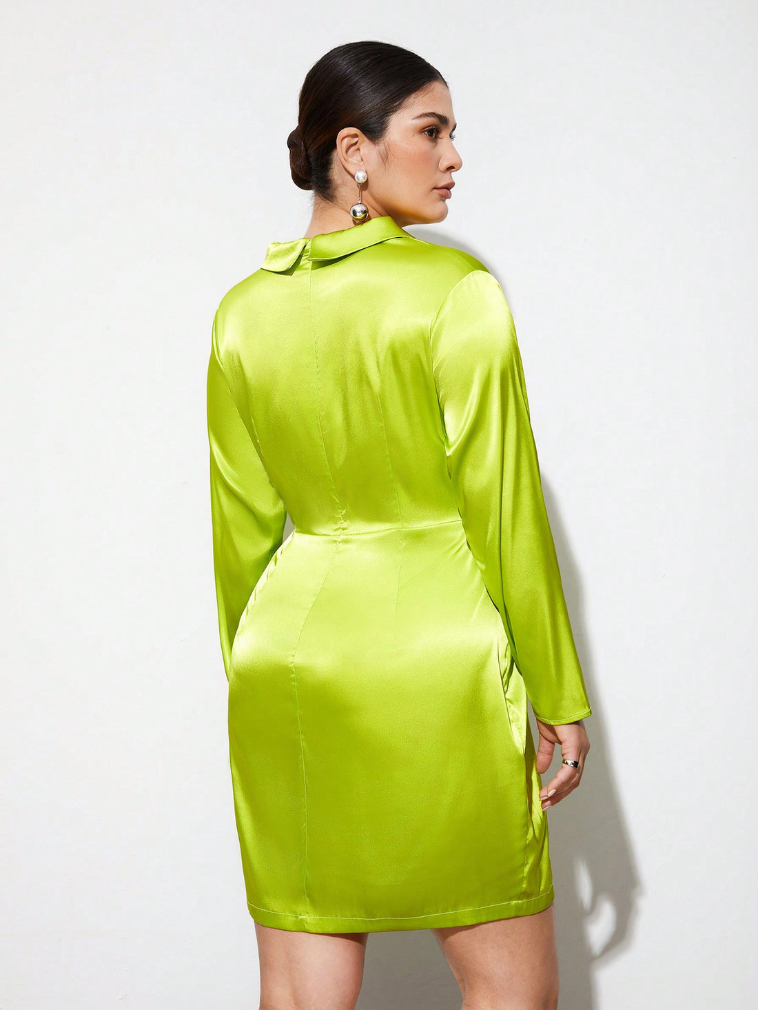 Turn heads effortlessly in this Elegant Plus Size Satin Short Dress. Its smooth, lustrous fabric drapes beautifully, offering a flattering fit that celebrates your curves. Perfect for any occasion, this chic dress combines comfort with style, making you feel confident and fabulous wherever you go. Embrace your elegance with a playful twist!