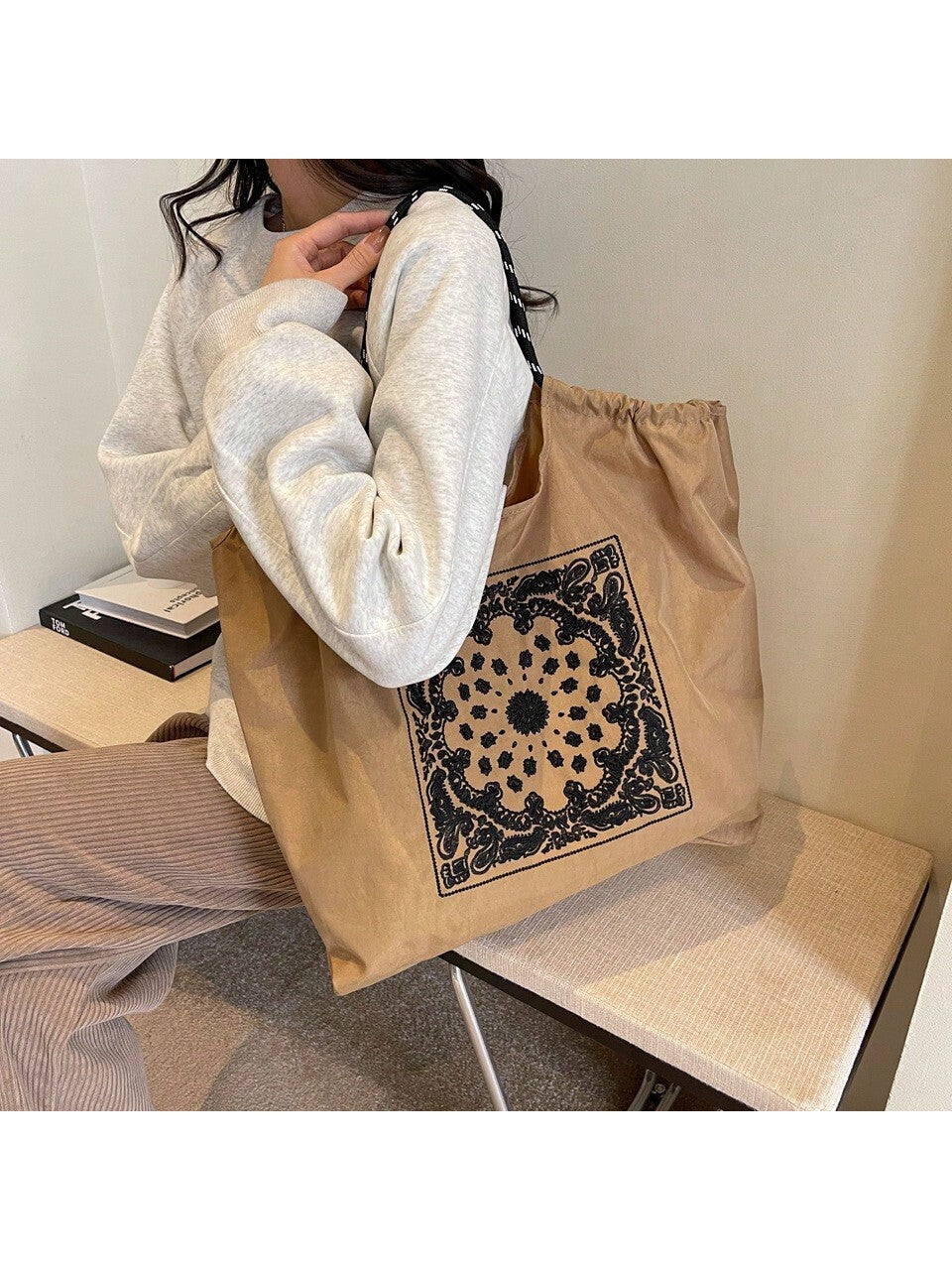 This Vintage Embroidered Nylon Tote is a must-have for any fashion-forward individual. Made with a stylish embroidered design, this tote is also spacious and convenient, making it perfect for everyday use. With a vintage twist and modern functionality, this tote is sure to elevate any outfit.