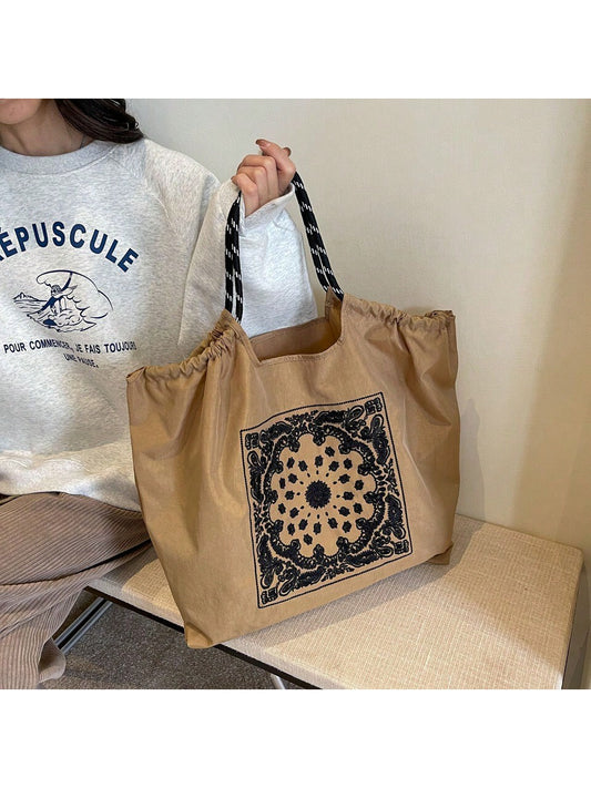 This Vintage Embroidered Nylon Tote is a must-have for any fashion-forward individual. Made with a stylish embroidered design, this tote is also spacious and convenient, making it perfect for everyday use. With a vintage twist and modern functionality, this tote is sure to elevate any outfit.