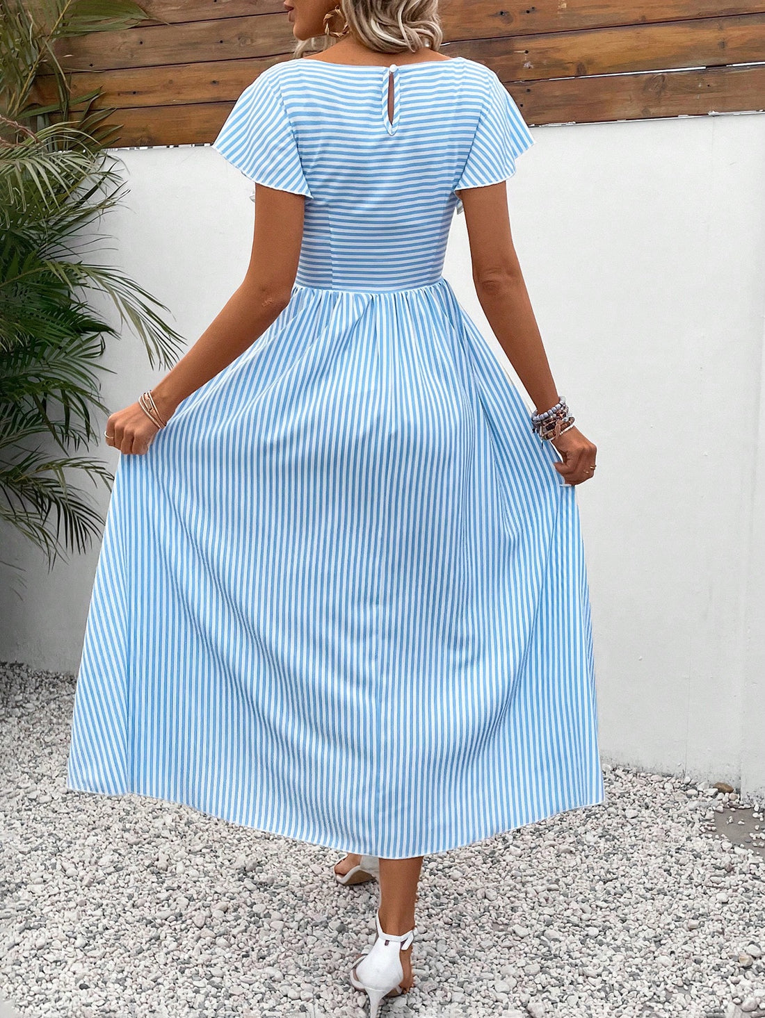Elevate your wardrobe with our Trendy Striped Shirred Ruffled Short-Sleeve Dress for Women. Featuring stylish stripes, shirred detailing, and ruffled sleeves, this dress is both trendy and versatile. Perfect for any occasion, this dress will make you feel confident and fashionable.