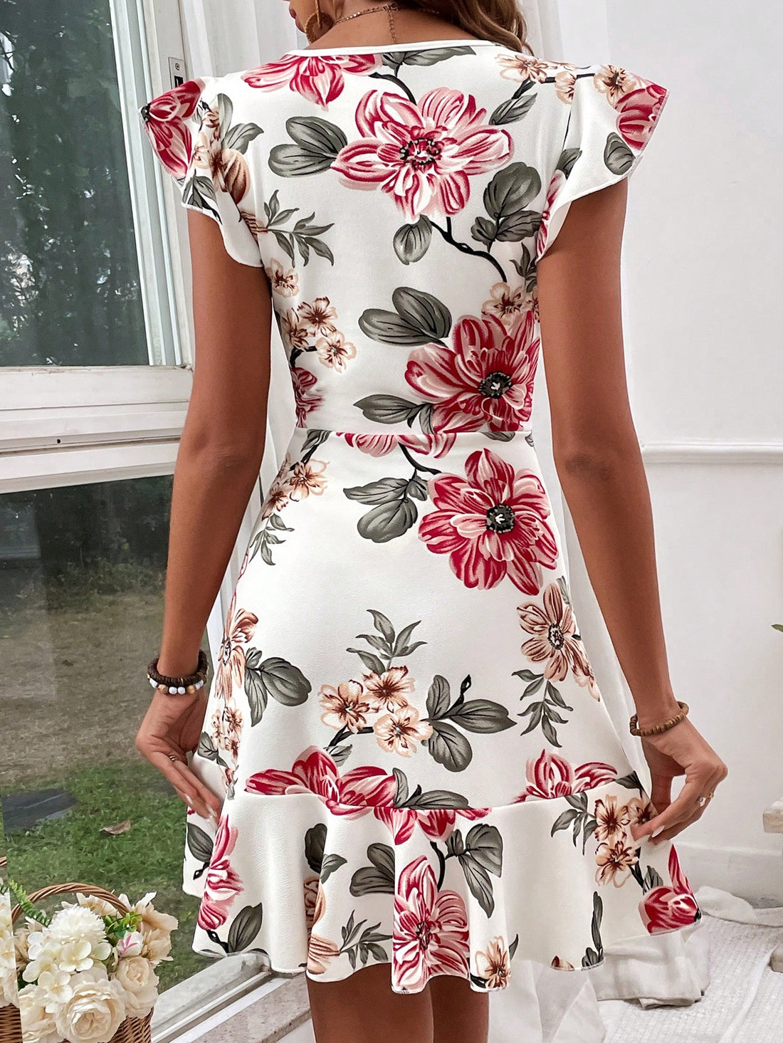 Elevate your summer wardrobe with our Chic Ruffled Sleeve Floral Print Dress. Its elegant design and lightweight fabric make it perfect for hot days. The stylish ruffled sleeves add a touch of sophistication, and the vibrant floral print will make you stand out in any crowd. Stay cool and fashionable all summer long.